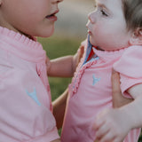 Kiki Baby baby pink polo romper worn by baby showing sweet country style