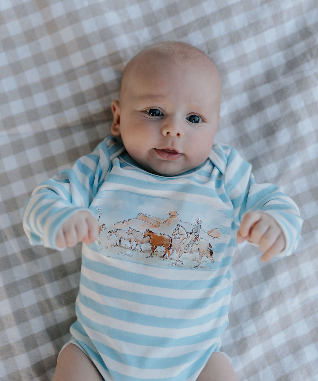 Colt blue stripe cotton jumpsuit back view showing comfortable cut and full stripe pattern