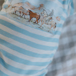 Colt blue stripe jumpsuit collar and button detail close-up showing quality cotton construction