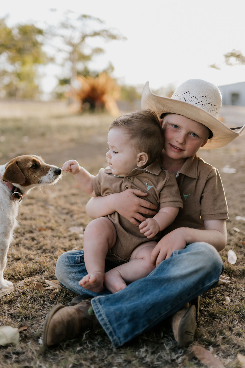 Clay Baby caramel romper worn by baby showing sweet country neutral style