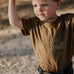 LIMITED EDITION embroidered kids tee dust brown front view showing signature LWCC logo on warm dusty brown