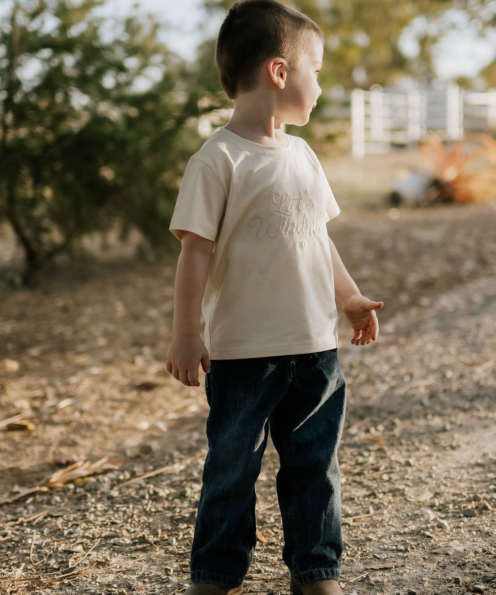 LIMITED EDITION embroidered kids tee cream worn by child showing boutique quality timeless country style