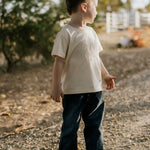 LIMITED EDITION embroidered kids tee cream worn by child showing boutique quality timeless country style