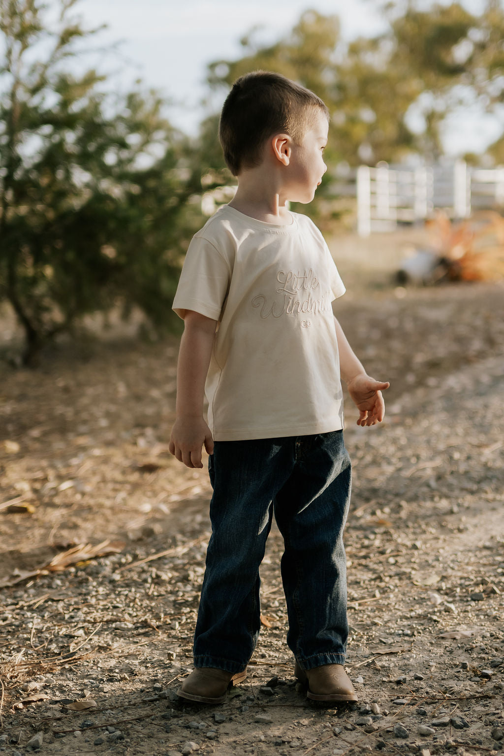 LIMITED EDITION embroidered kids tee cream worn by child showing boutique quality timeless country style