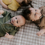 Ky Baby khaki green polo romper snap detail showing easy nappy change access
