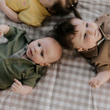 Ky Baby khaki green polo romper snap detail showing easy nappy change access