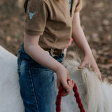 Clayton caramel boy's polo worn by boy showing smart casual country style in warm tones
