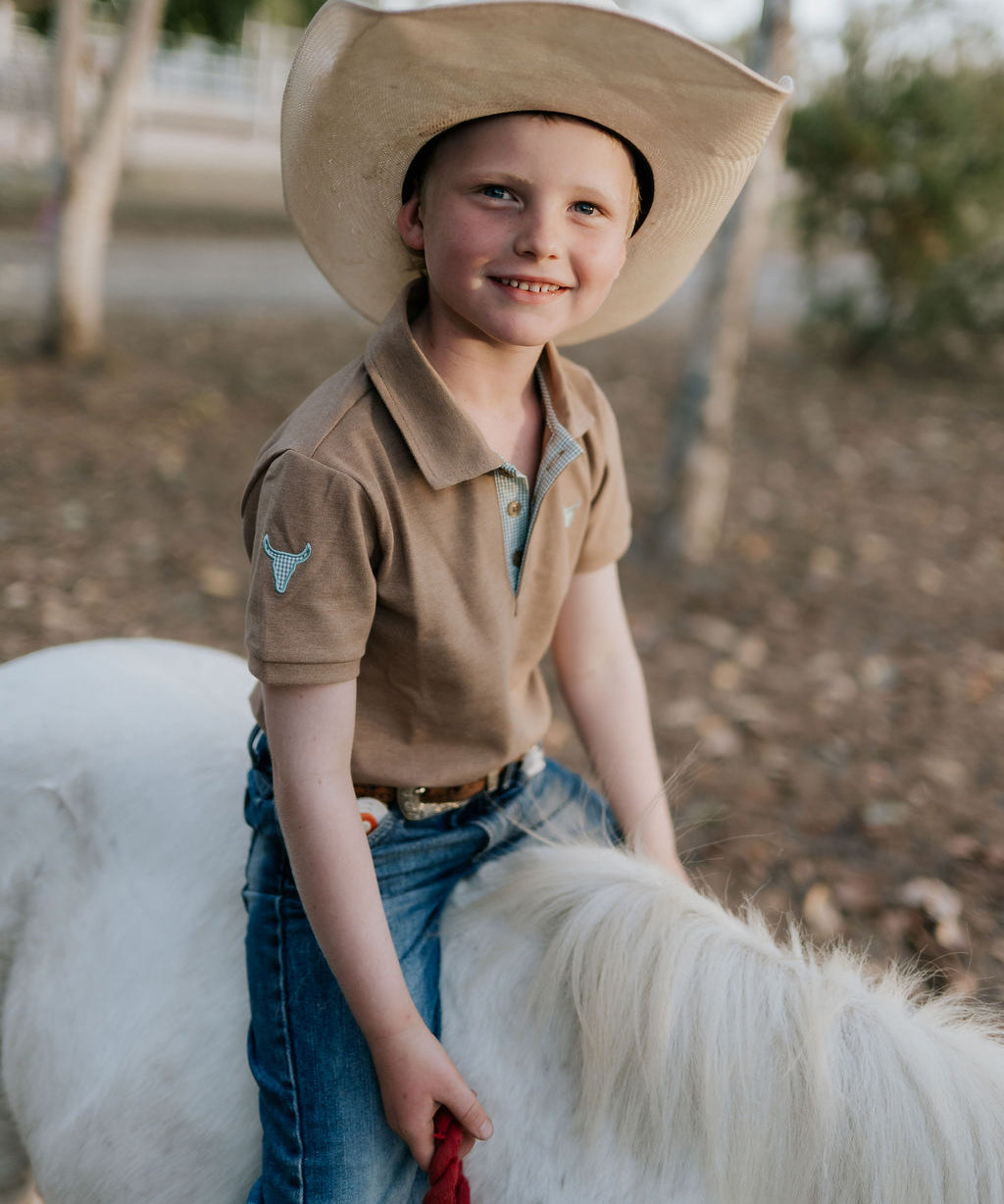 Clayton caramel boy's polo front view showing classic polo style in warm caramel tone for boys