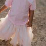 LIMITED EDITION embroidered kids tee soft pink front view showing signature LWCC embroidered logo on soft pink