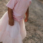 LIMITED EDITION embroidered kids tee soft pink collar detail showing premium quality
