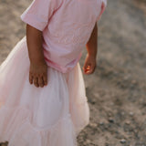 LIMITED EDITION embroidered kids tee soft pink collar detail showing premium quality