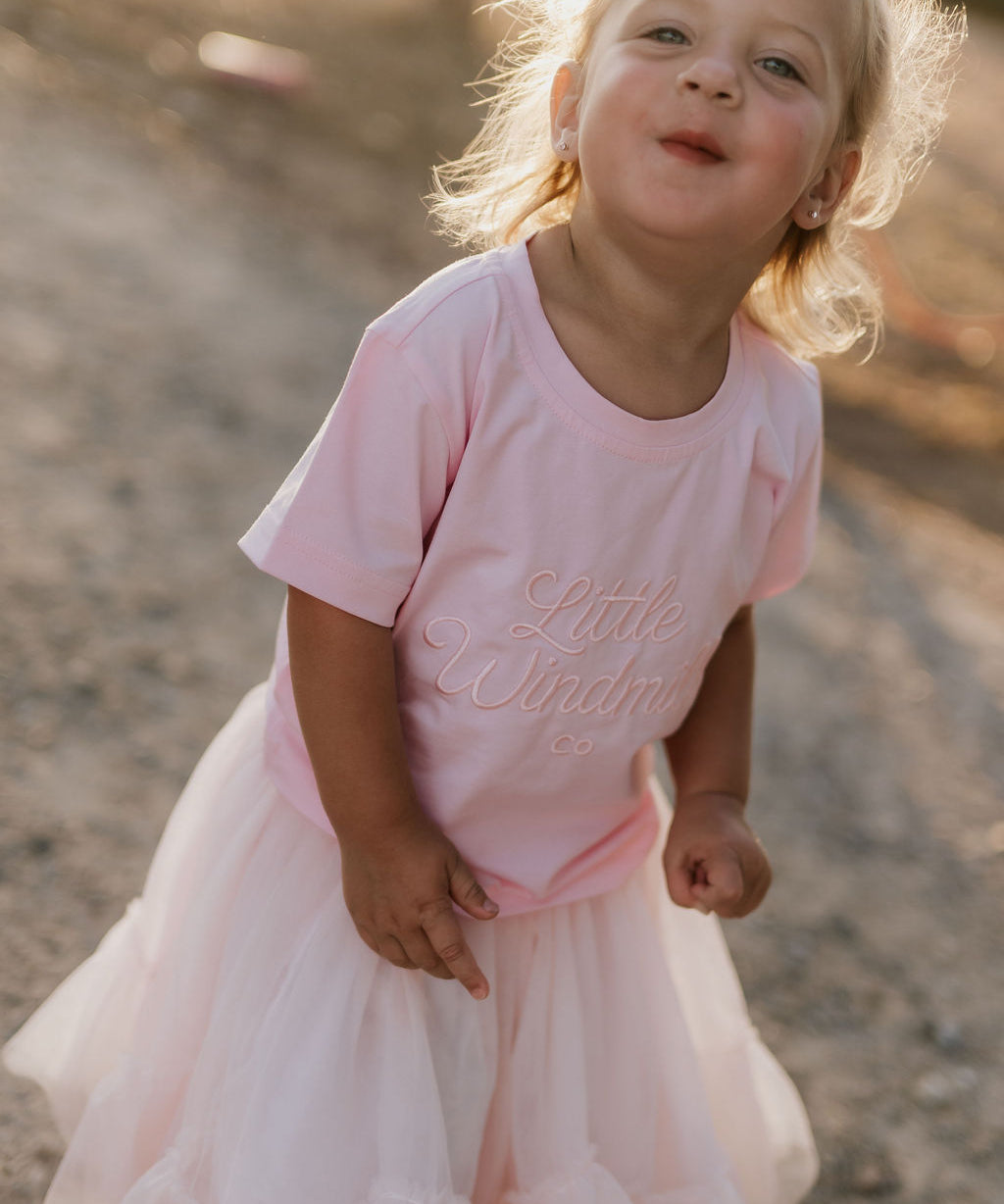 LIMITED EDITION embroidered kids tee soft pink back view showing relaxed fit and sweet pink colourway