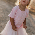 LIMITED EDITION embroidered kids tee soft pink back view showing relaxed fit and sweet pink colourway