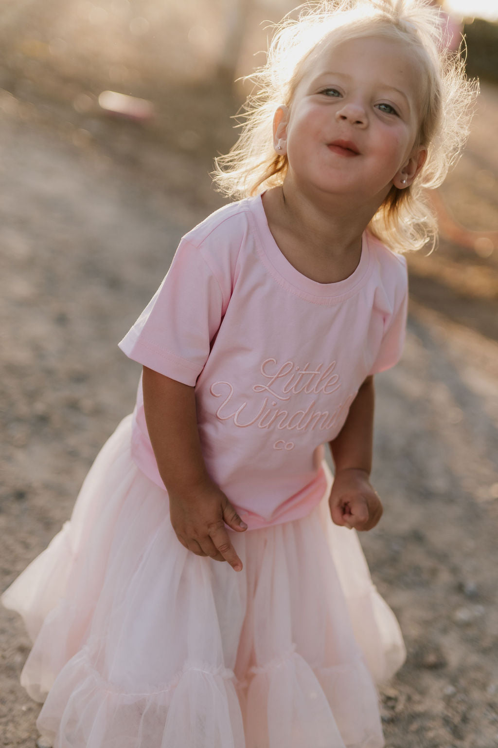 LIMITED EDITION embroidered kids tee soft pink back view showing relaxed fit and sweet pink colourway