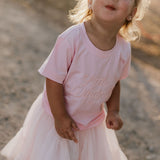 LIMITED EDITION embroidered kids tee soft pink back view showing relaxed fit and sweet pink colourway