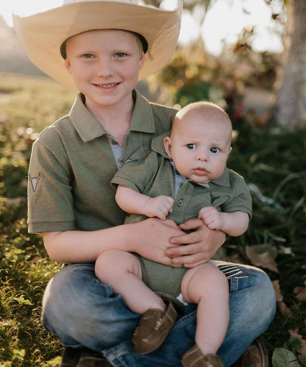 Ky Baby khaki green romper worn by baby showing adorable country neutral style