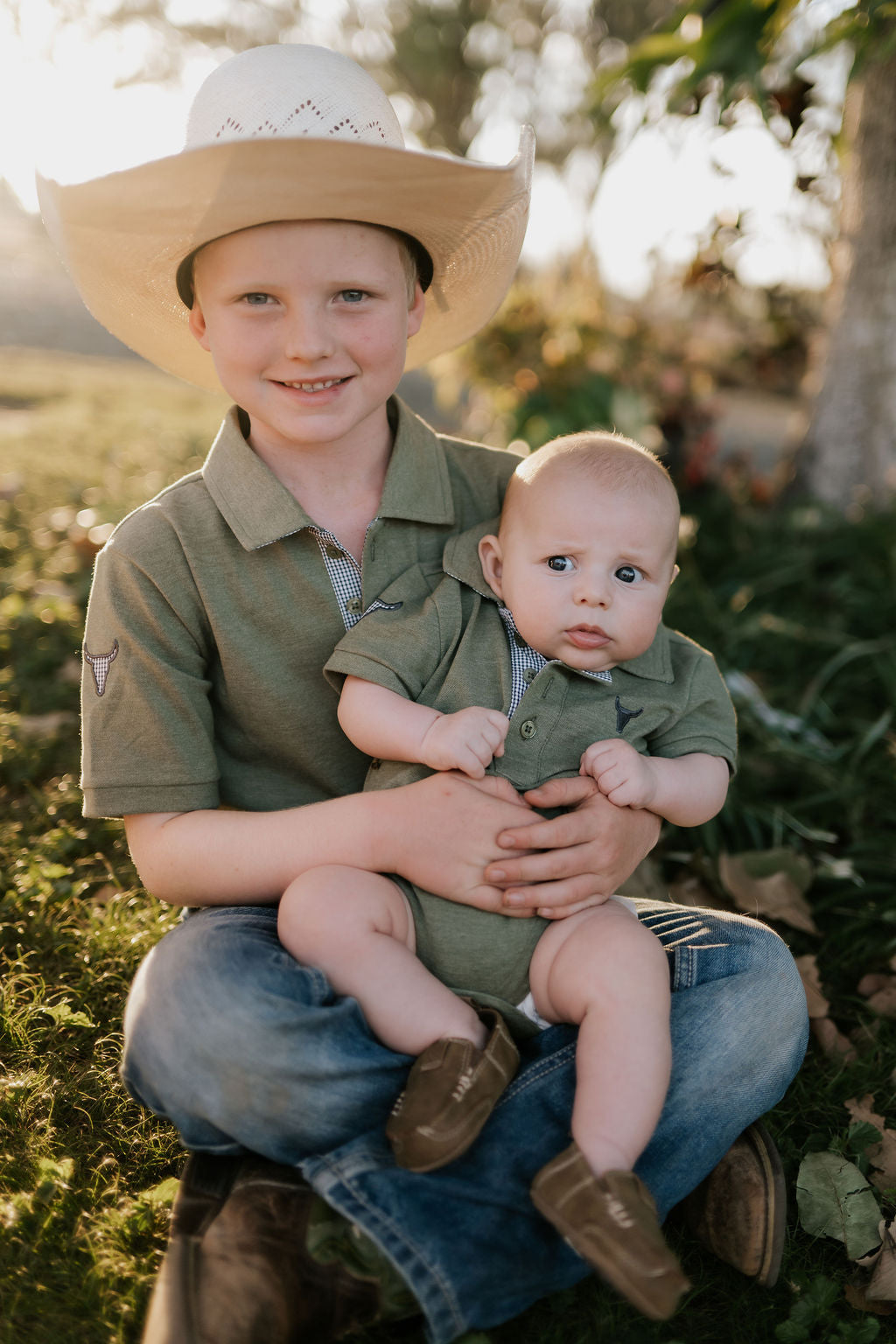 Ky Baby khaki green romper worn by baby showing adorable country neutral style
