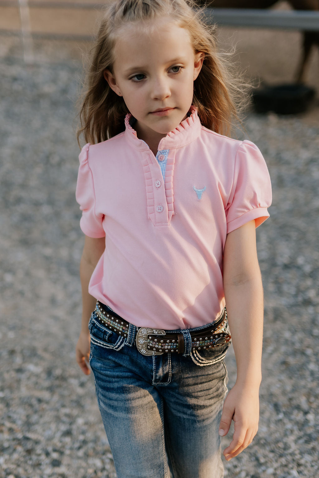 Keira baby pink ruffle polo front view showing beautiful ruffle collar in soft baby pink with feminine detail