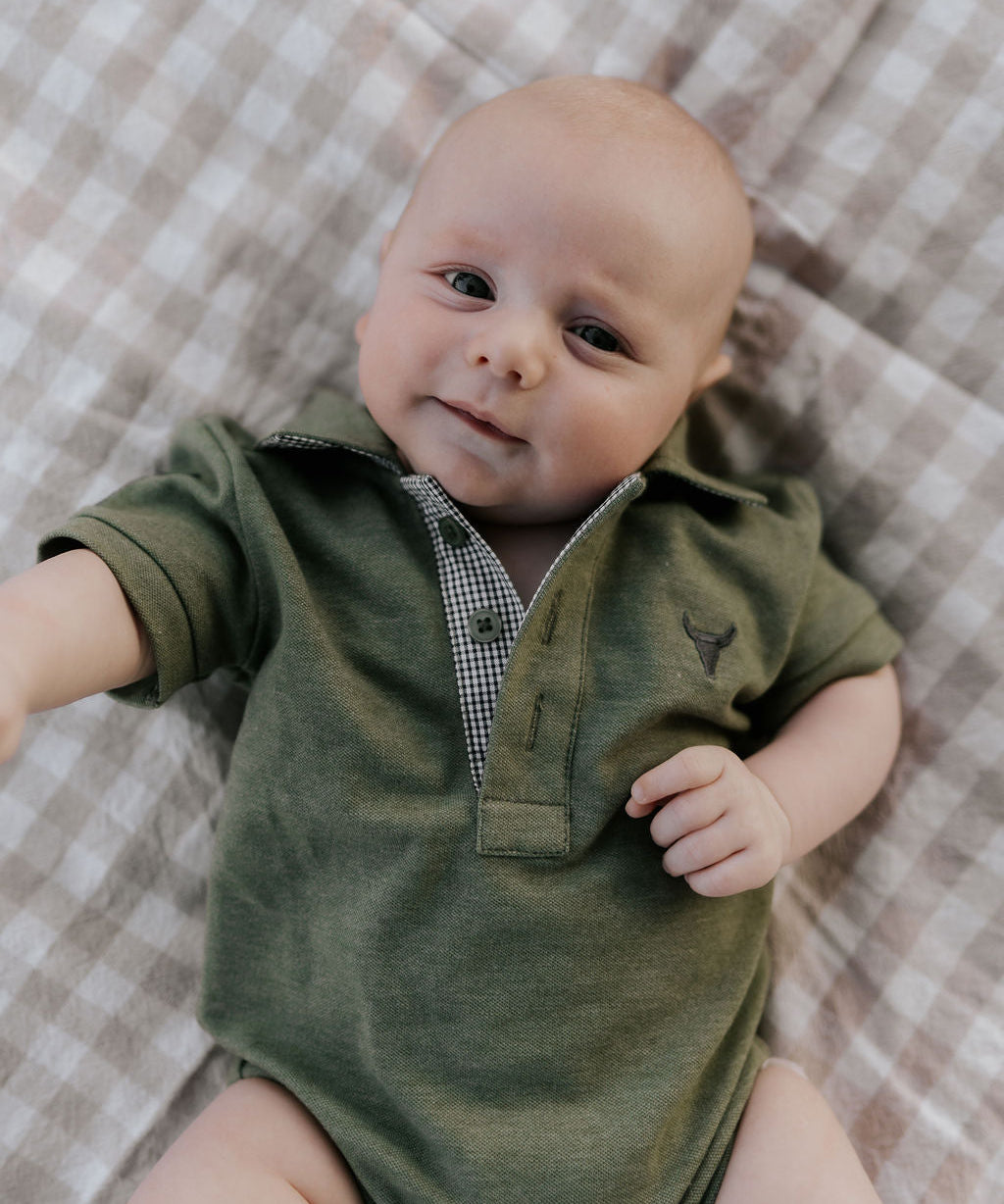 Ky Baby khaki green baby polo romper front view showing earthy khaki green polo collar romper with snap buttons