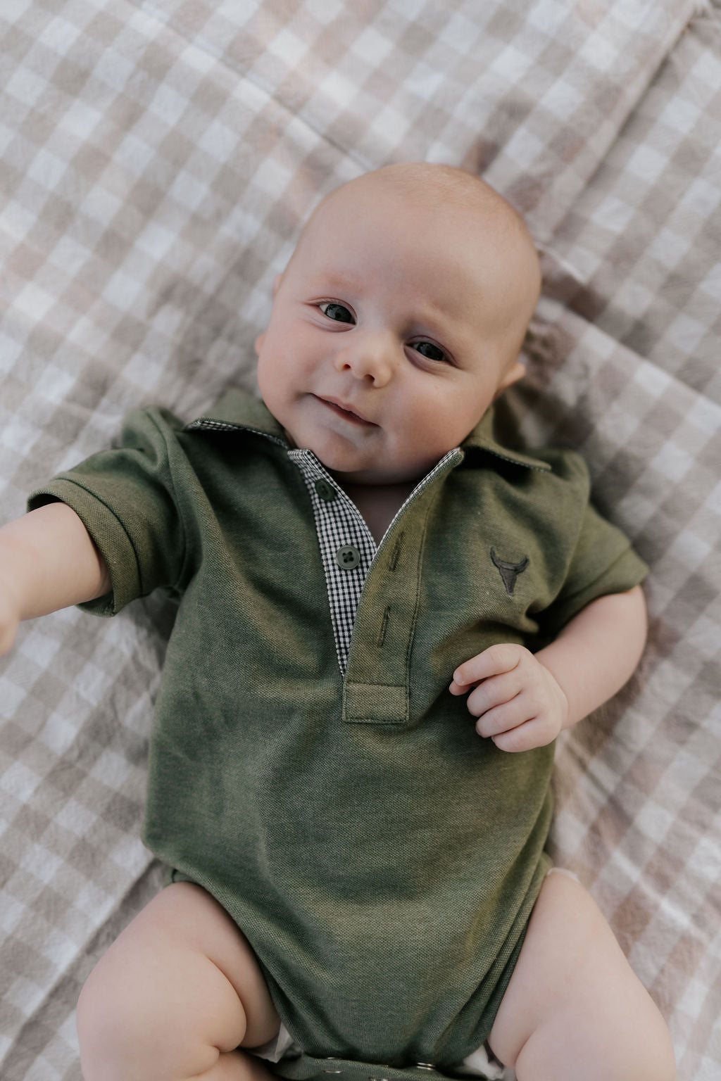 Ky Baby khaki green baby polo romper front view showing earthy khaki green polo collar romper with snap buttons