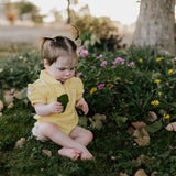 Larrisa Baby butter yellow romper worn by baby showing sweet country style in sunny yellow