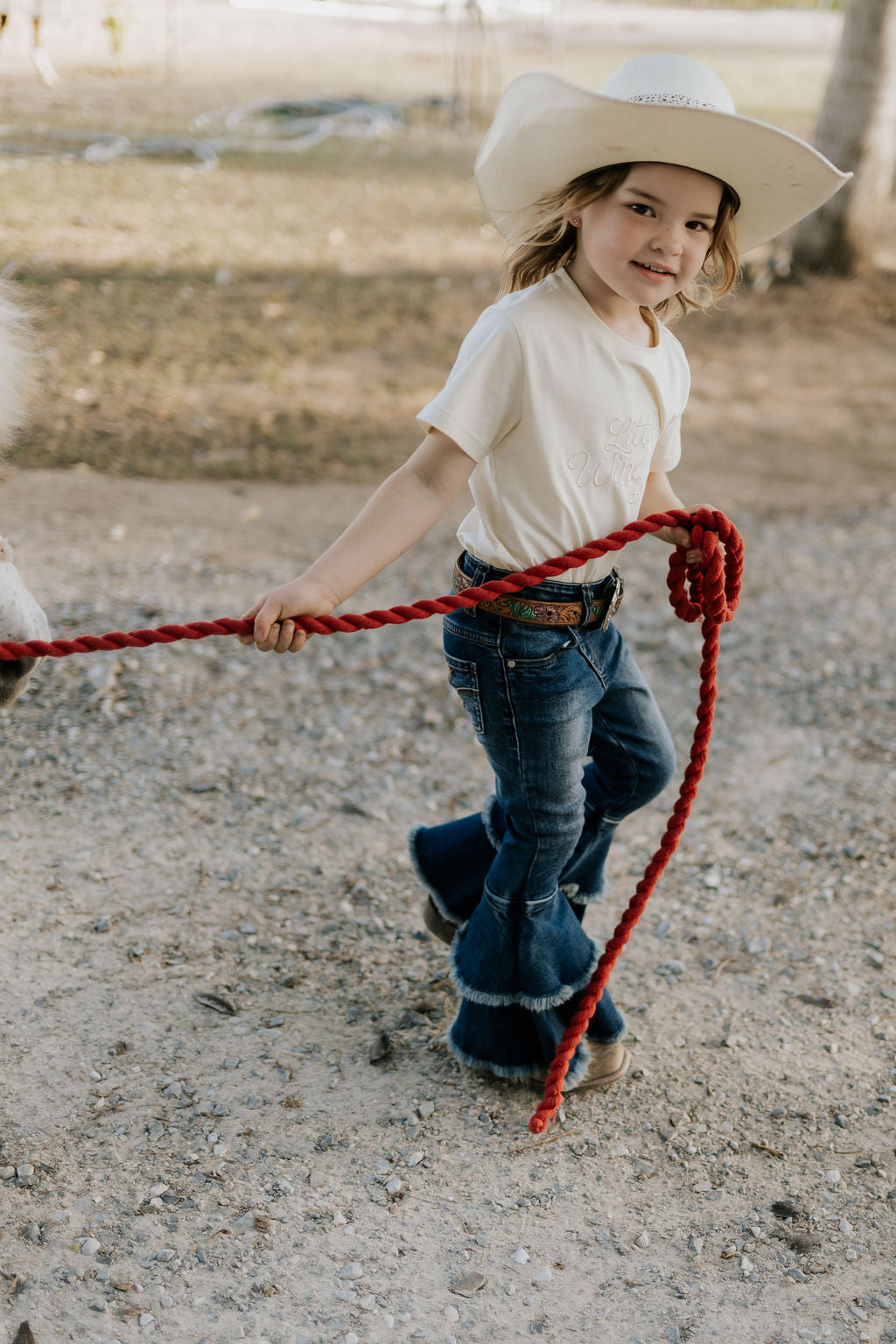 LIMITED EDITION embroidered kids tee cream flat lay showing full design and classic cream