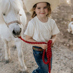 LIMITED EDITION embroidered kids tee cream collar detail showing premium tee quality
