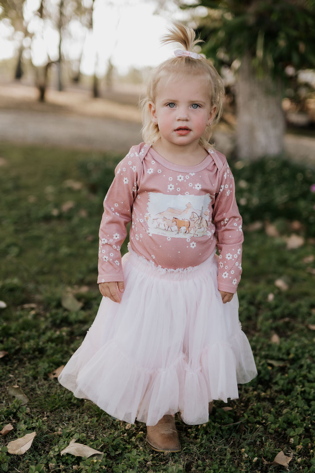 Filly floral jumpsuit snap detail showing easy access for girls