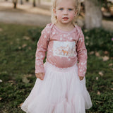Filly floral jumpsuit snap detail showing easy access for girls