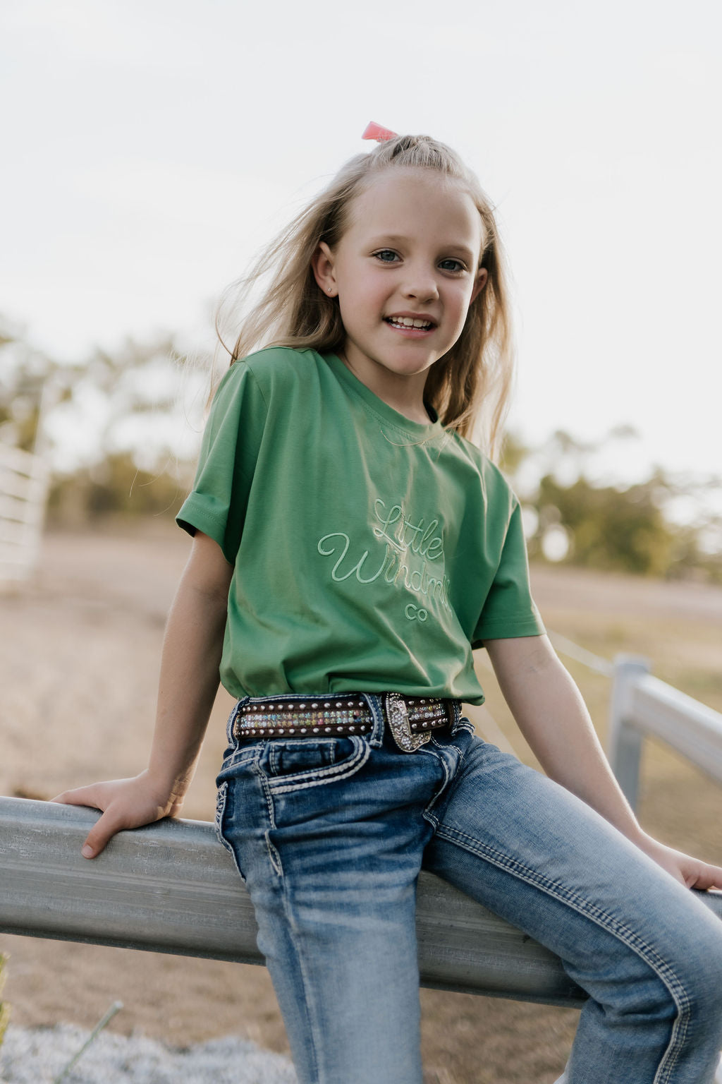 LIMITED EDITION embroidered kids tee moss green back view showing relaxed fit and earthy moss colourway