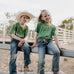 LIMITED EDITION embroidered kids tee moss green front view showing signature LWCC embroidered logo on premium moss green