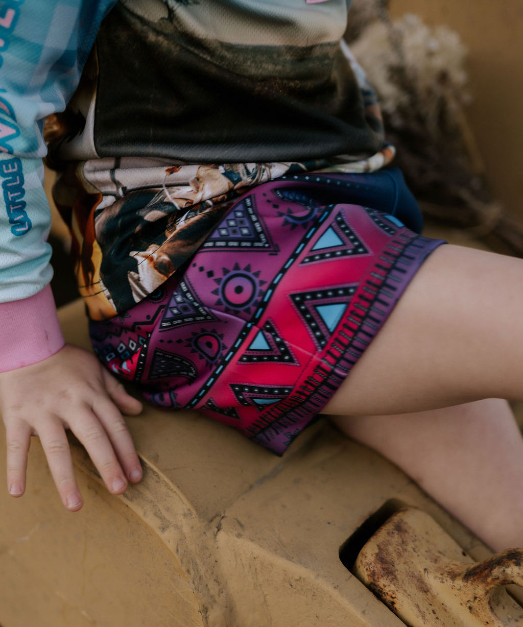 Aztec navy footy shorts front view showing bold geometric aztec print on navy shorts