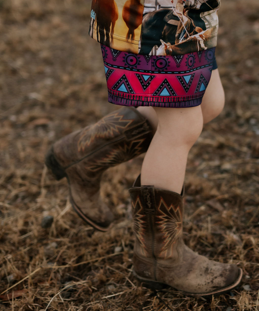 Aztec navy footy shorts back view showing elastic waistband and full aztec pattern