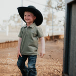 Keith khaki green boy's polo worn by boy showing smart casual country style
