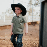 Keith khaki green boy's polo worn by boy showing smart casual country style