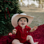 Nicco Baby deep red polo romper worn by baby showing sweet matching family polo style