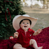 Nicco Baby deep red polo romper worn by baby showing sweet matching family polo style