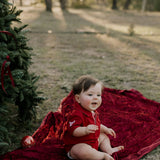 Nicco Baby deep red polo romper fabric close-up showing quality deep red pique