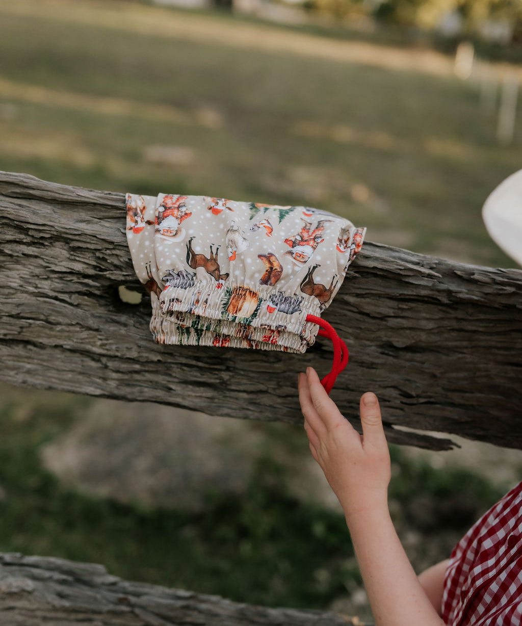 Western Christmas PJ set showing coordinating top and bottom pieces in holiday western print