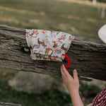 Western Christmas PJ set showing coordinating top and bottom pieces in holiday western print