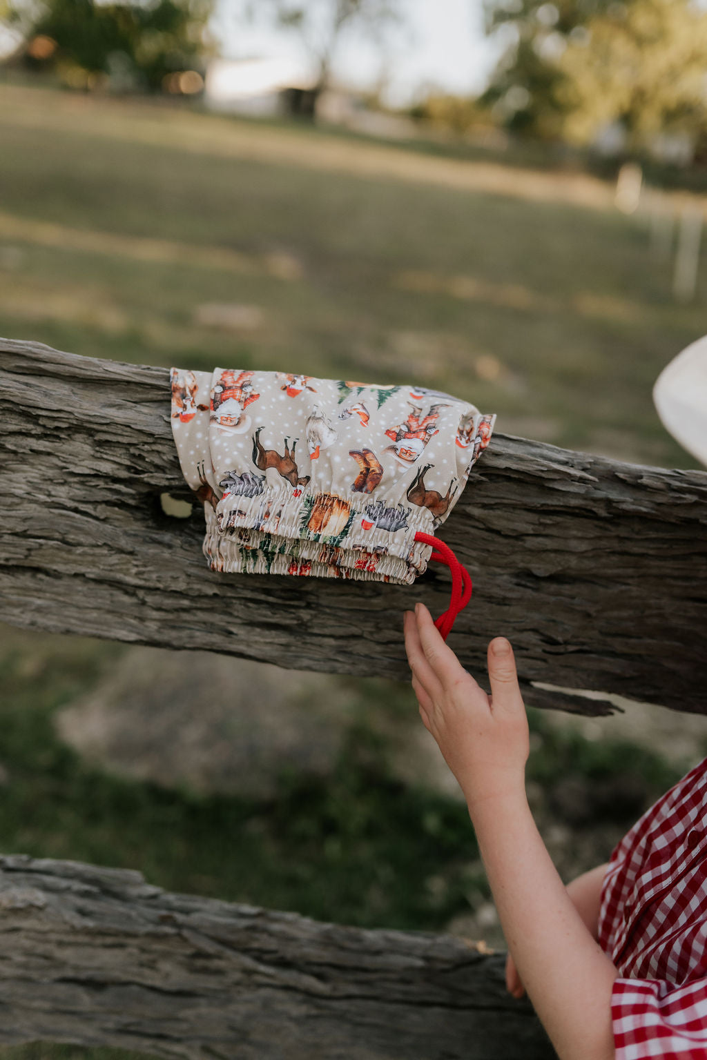 Western Christmas PJ set showing coordinating top and bottom pieces in holiday western print