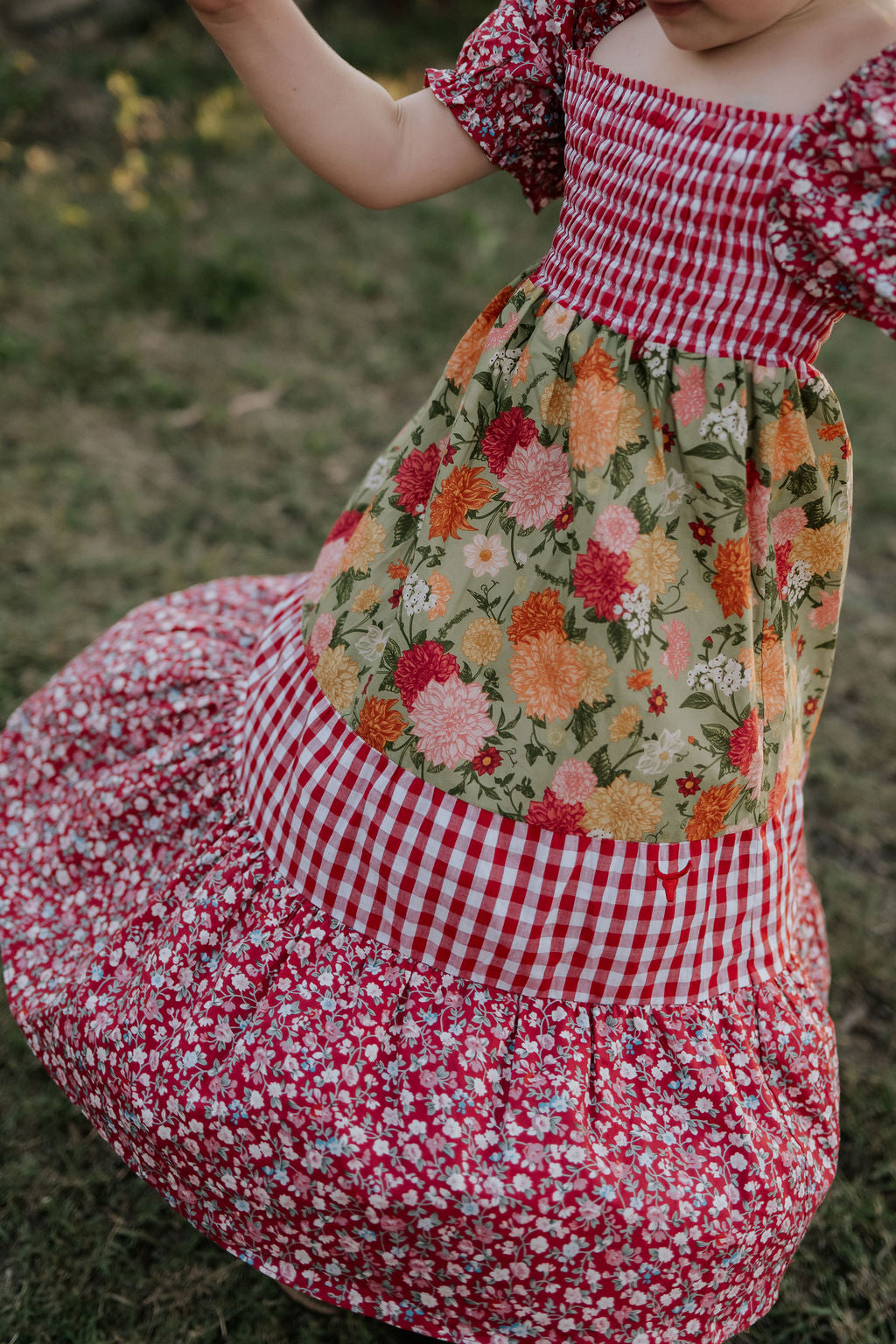 Penelope block twirl dress side view showing full layered skirt volume