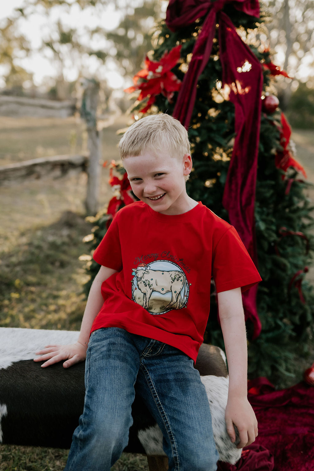 Western printed Christmas cow tee detail showing vibrant holiday western print quality