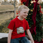 Western printed Christmas cow tee worn showing fun festive Christmas cow graphic on quality tee
