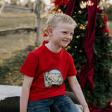 Western printed Christmas cow tee worn showing fun festive Christmas cow graphic on quality tee