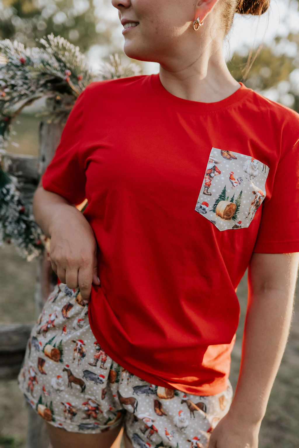 Ladies Western Christmas PJ set flatlay showing festive western print women's pyjama top and pants