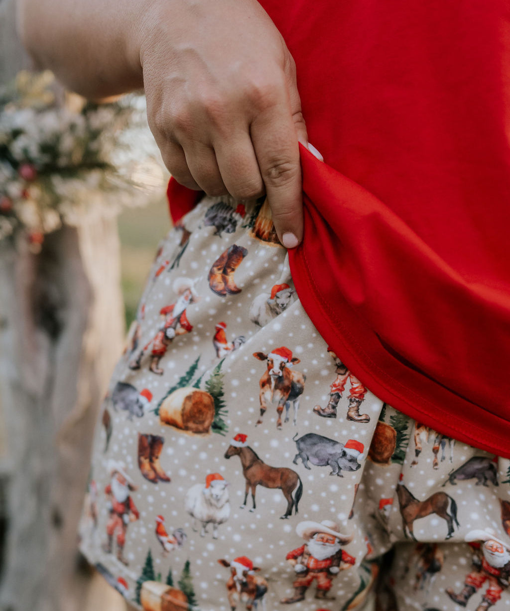 Western Christmas PJ set print close-up showing detailed festive western holiday print