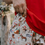 Western Christmas PJ set print close-up showing detailed festive western holiday print
