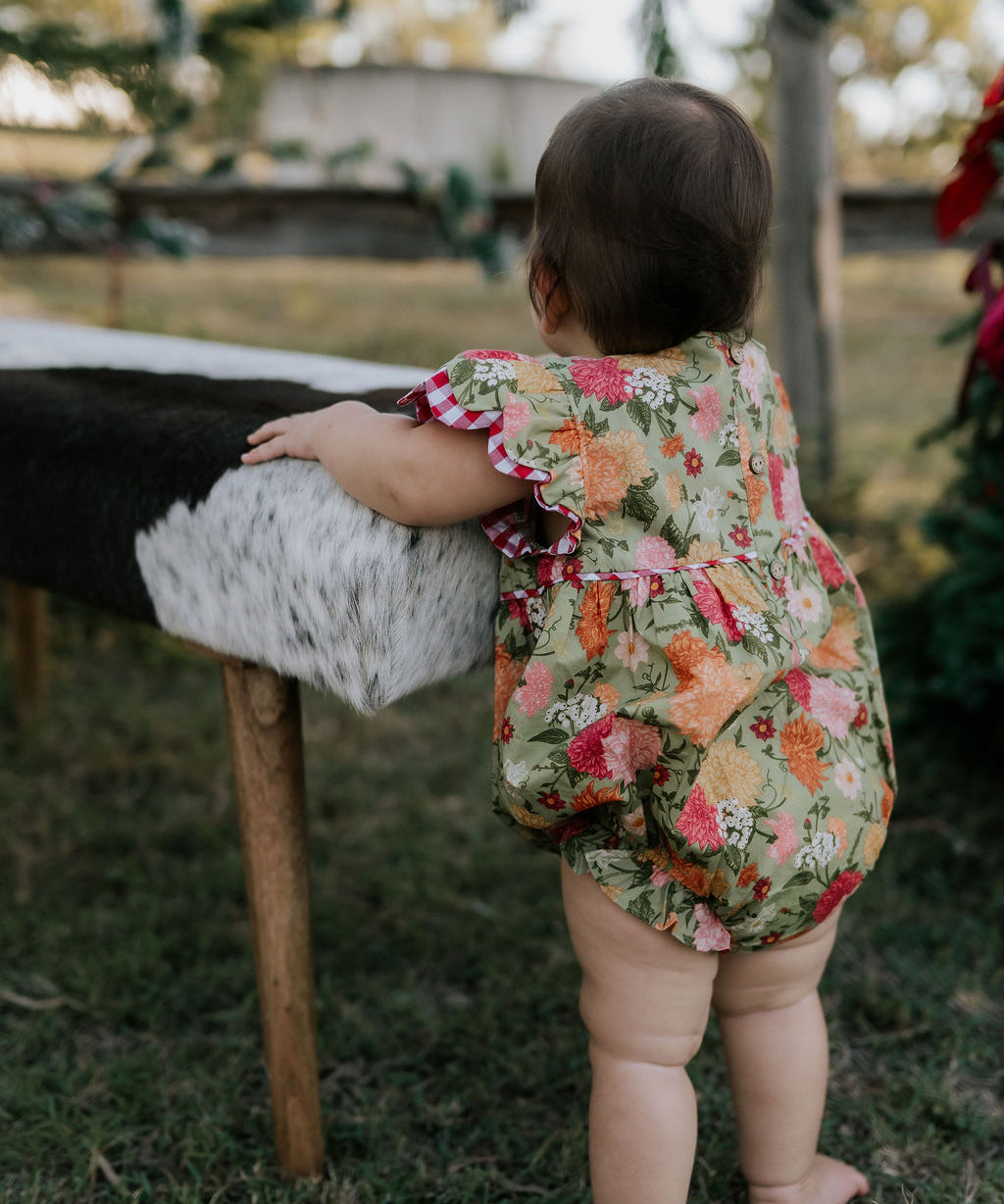 Faith floral scallop short sleeve romper front view showing sweet floral print scalloped romper for girls