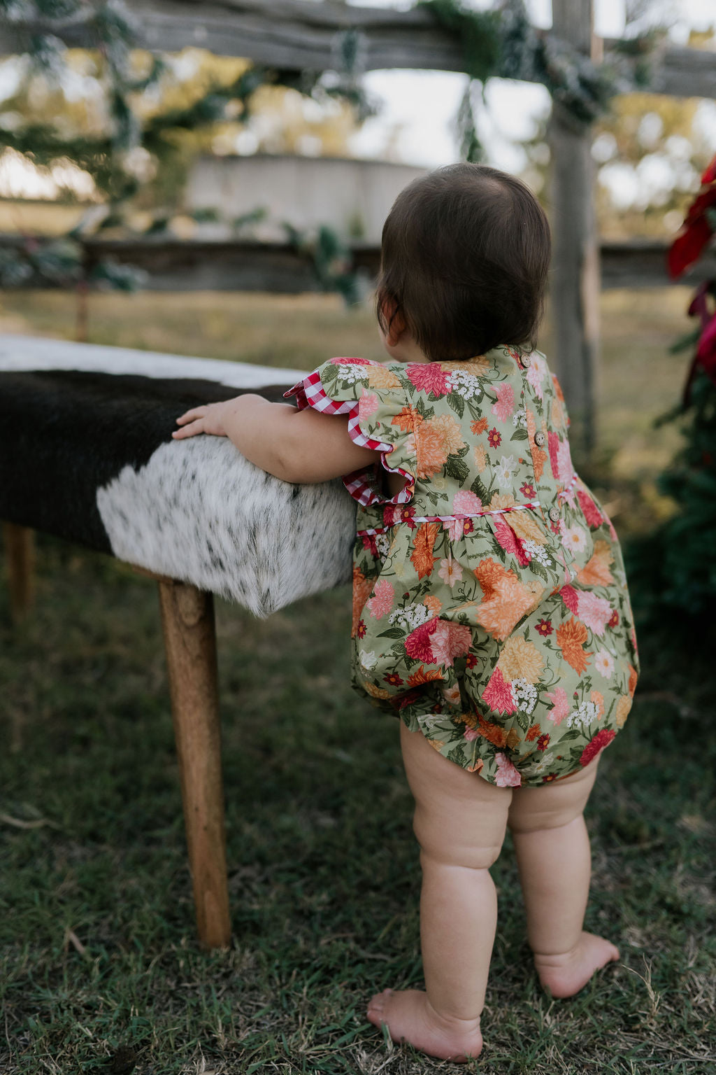 Faith floral scallop short sleeve romper front view showing sweet floral print scalloped romper for girls